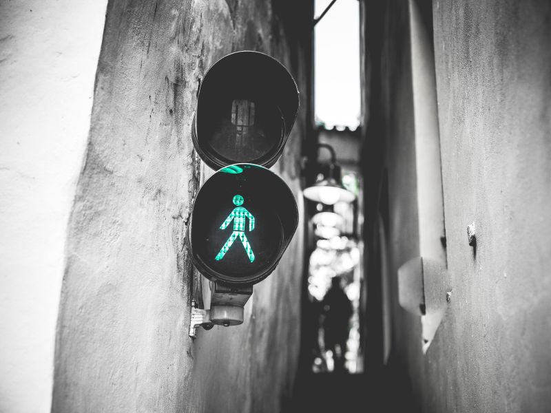 greentrafficlightwalksignalinnarroweststreet.jpg