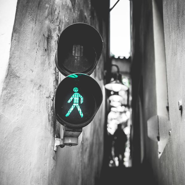 greentrafficlightwalksignalinnarroweststreet.jpg